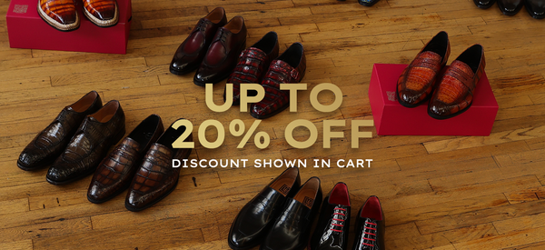 Men’s luxury dress shoes displayed on a wood floor with text reading ‘Up to 20% off, discount shown in cart.