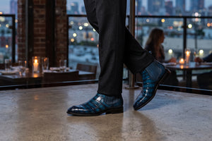 Man in Restaurant with blue exotic boots on 